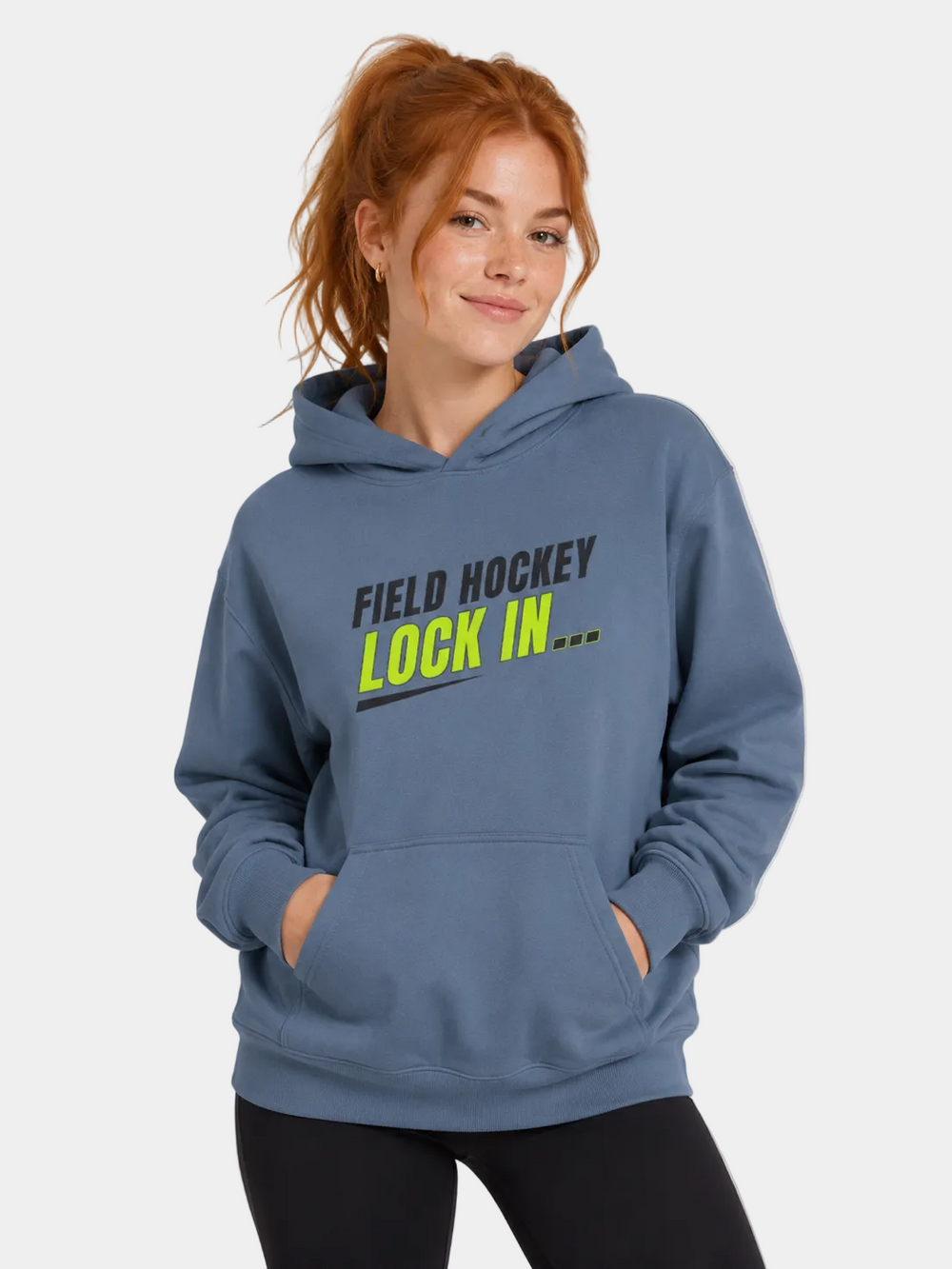 Person wearing a blue hoodie with 'Field Hockey Lock In' text on a light gray background