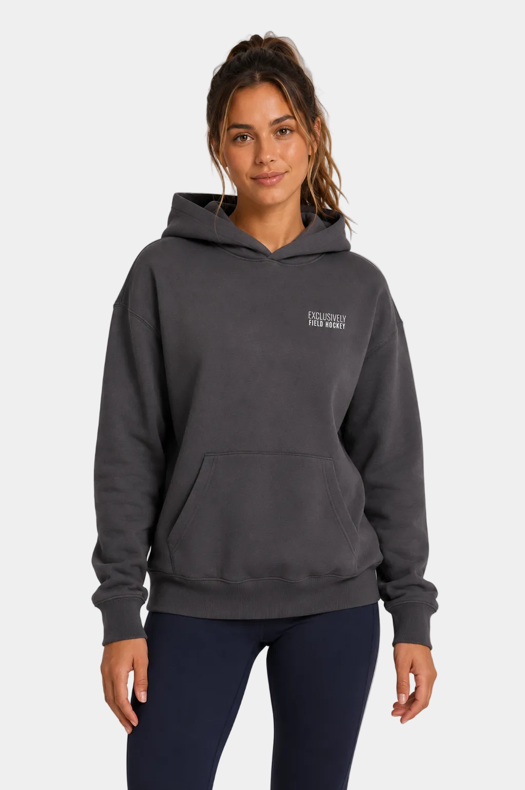 Women's field hockey ultra heavyweight hoodie in Pigment Black with embroidered Exclusively Field Hockey logo. Premium oversized fleece hoodie for field hockey players, training, tournaments, and everyday wear.