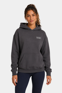 Women's field hockey ultra heavyweight hoodie in Pigment Black with embroidered Exclusively Field Hockey logo. Premium oversized fleece hoodie for field hockey players, training, tournaments, and everyday wear.