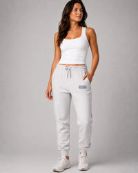 Field hockey player wearing Field Hockey Sweatpants that are embroidered exclusively field hockey.