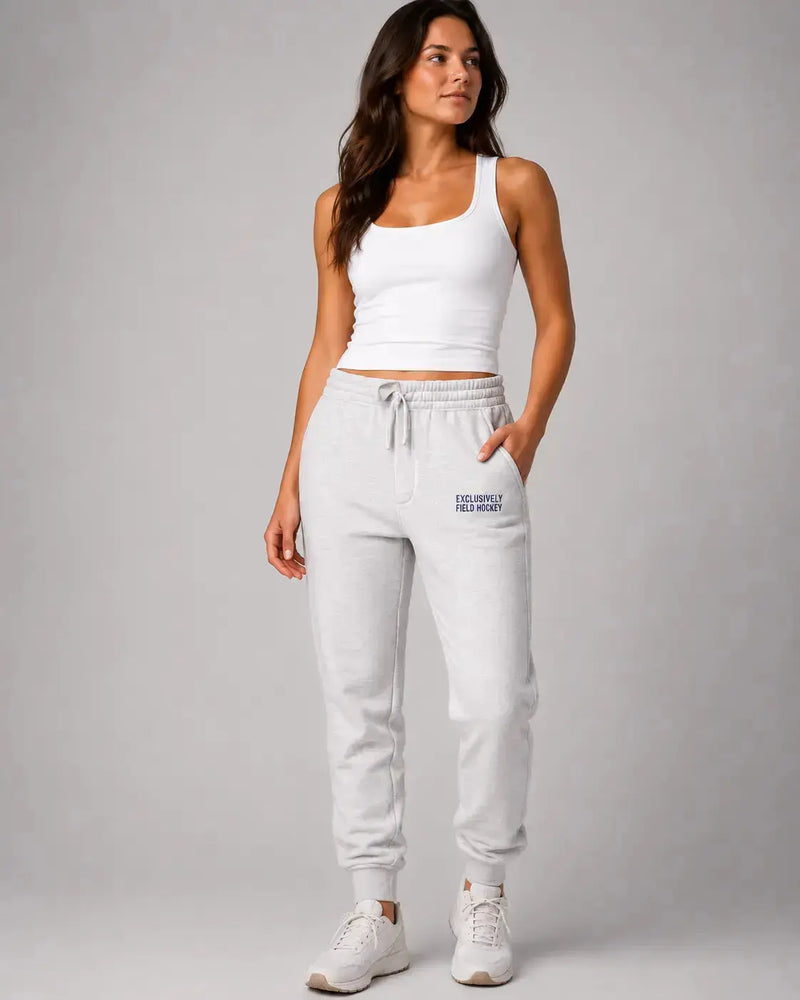 Field hockey player wearing Field Hockey Sweatpants that are embroidered exclusively field hockey.