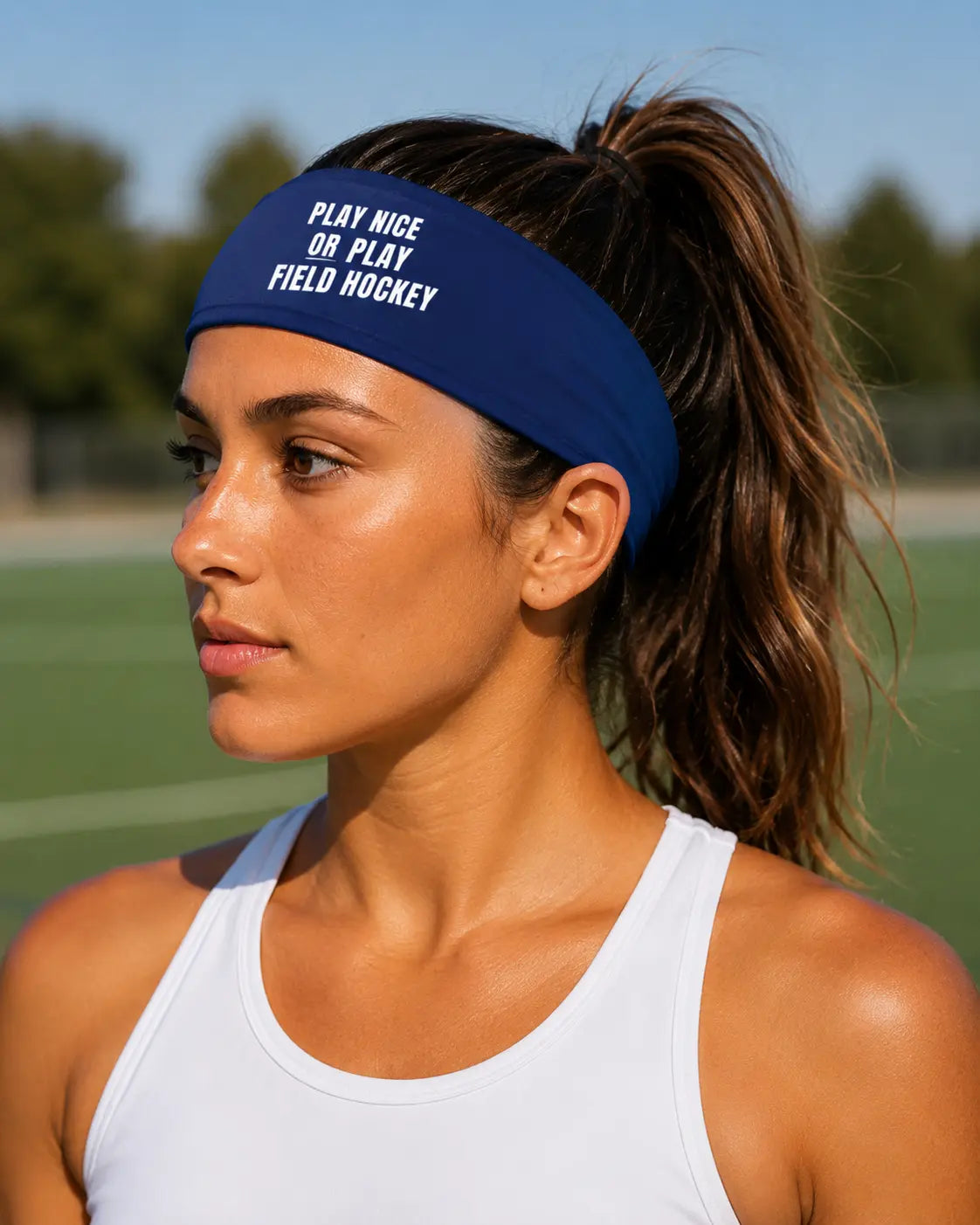 Field Hockey player wearing field hockey headband that says play nice or play field hockey.